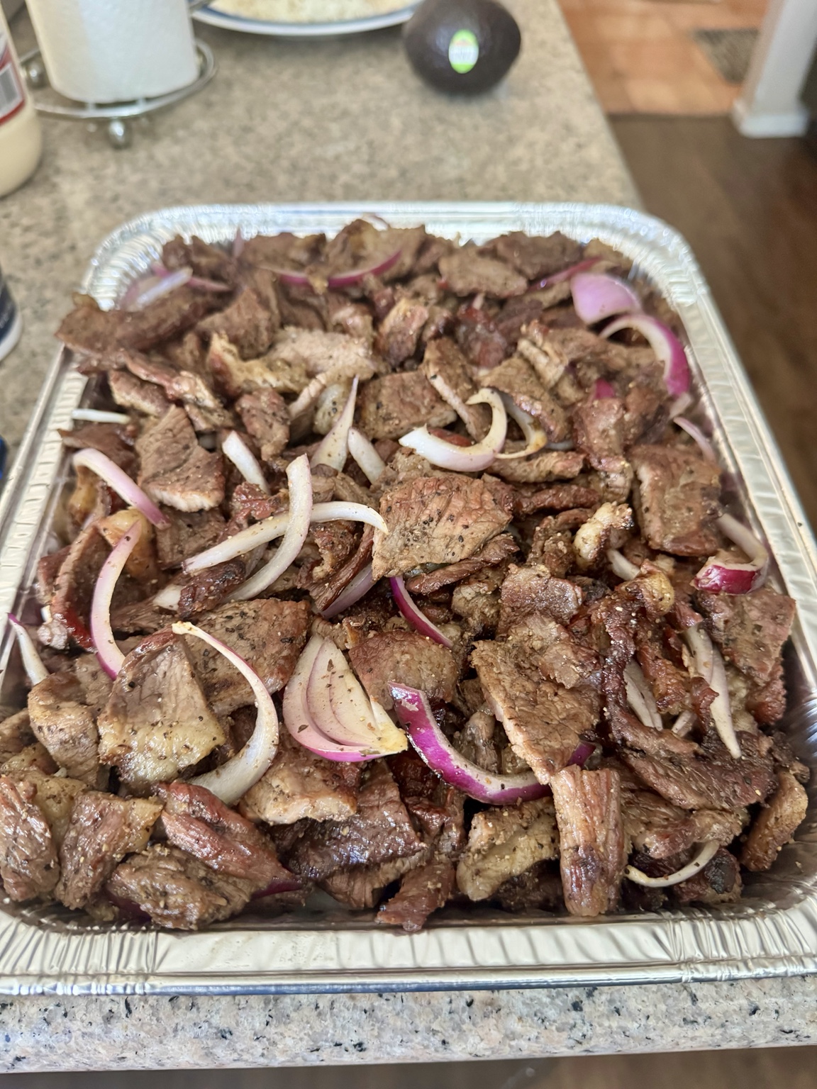 Brisket suya with sliced onions